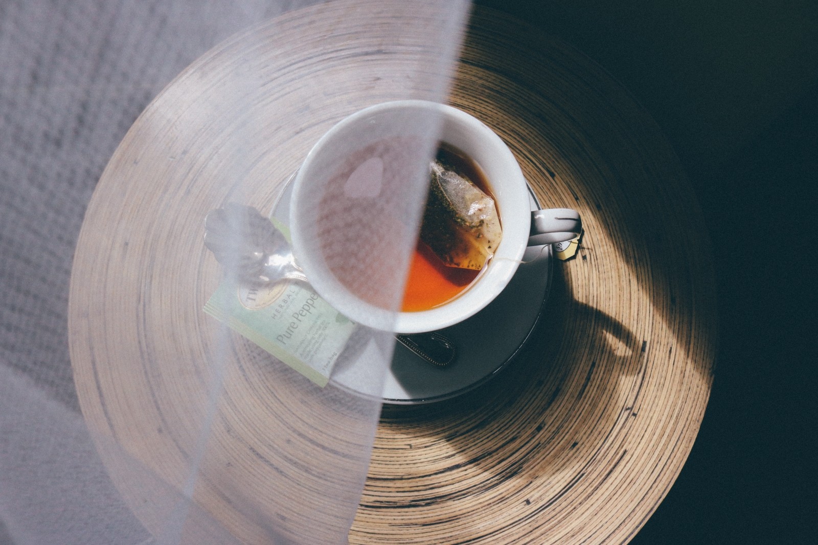 cup of tea behind a curtain